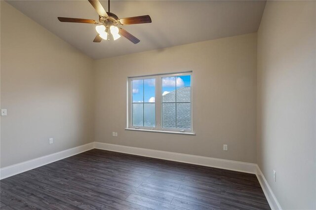 empty room with ceiling fan and dark hardwood / wood-style floors