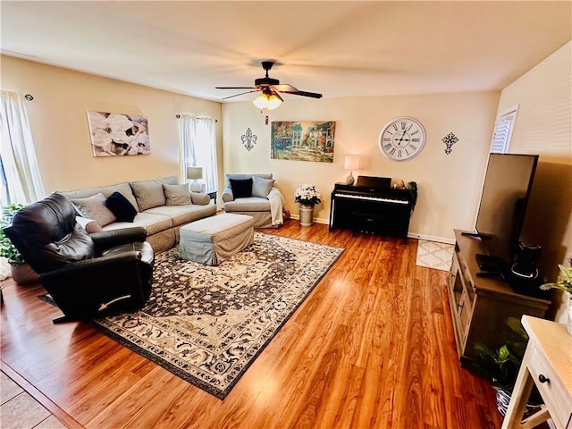 living room with ceiling fan and hardwood / wood-style floors