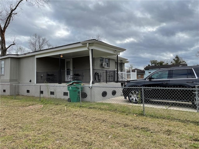 view of home's exterior featuring a lawn and a porch