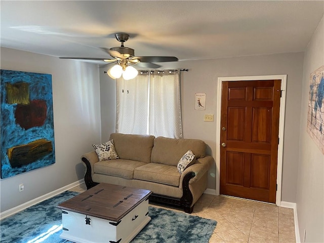 tiled living room with ceiling fan