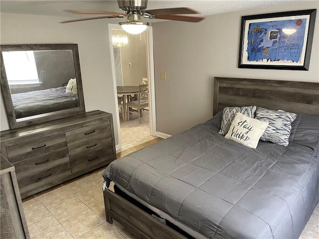 bedroom featuring ceiling fan and light tile patterned flooring