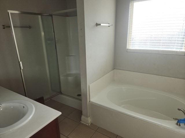 bathroom with vanity, separate shower and tub, and tile patterned flooring