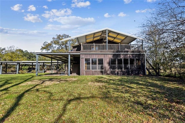 back of house with a lawn