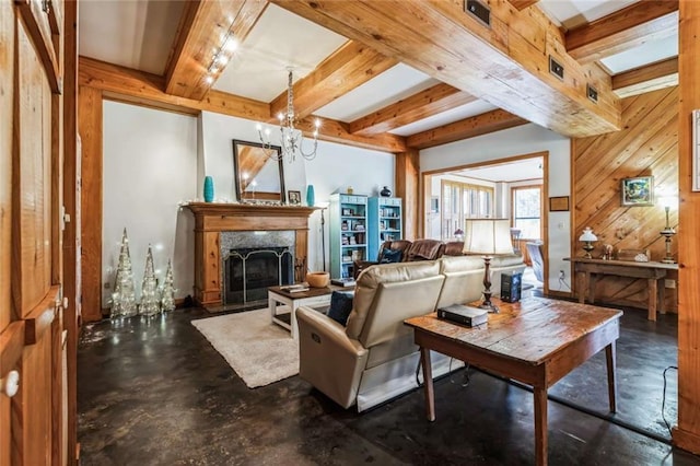 living room featuring a notable chandelier, wooden walls, and beamed ceiling