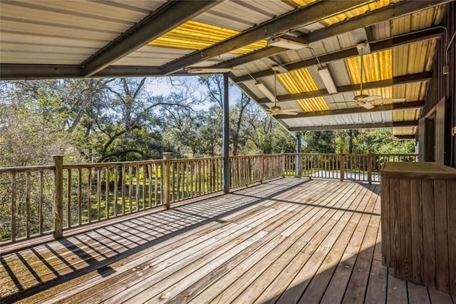 wooden terrace featuring ceiling fan