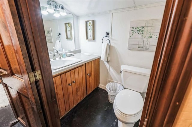 bathroom featuring toilet and vanity