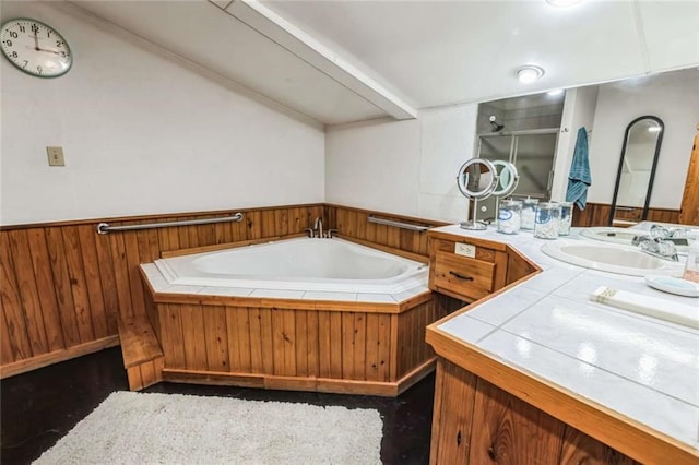 bathroom with separate shower and tub, wood walls, and vanity