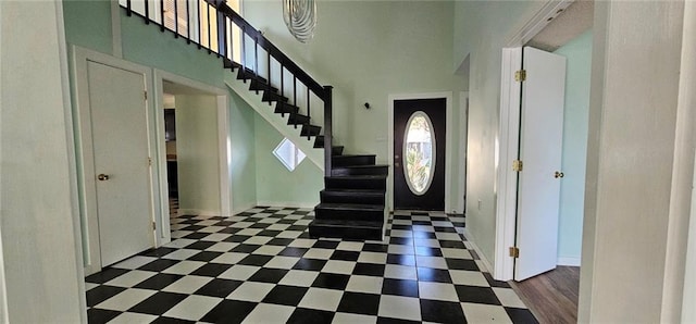 4410 San Remo Rd, New Orleans, LA 70129 - foyer entrance featuring stairs and a towering ceiling