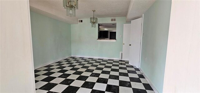 empty room with a textured ceiling