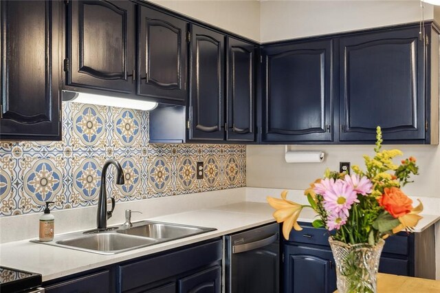 kitchen with sink, black dishwasher, and tasteful backsplash