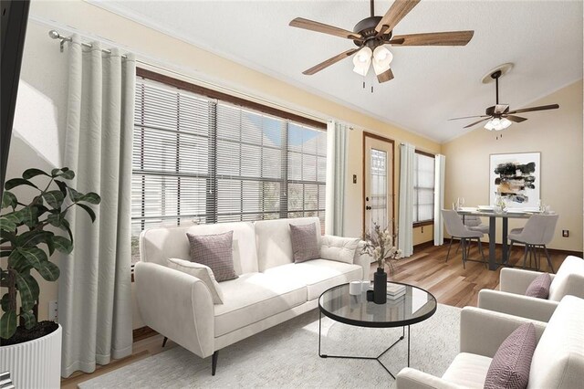 living room featuring vaulted ceiling, ceiling fan, ornamental molding, and light hardwood / wood-style floors