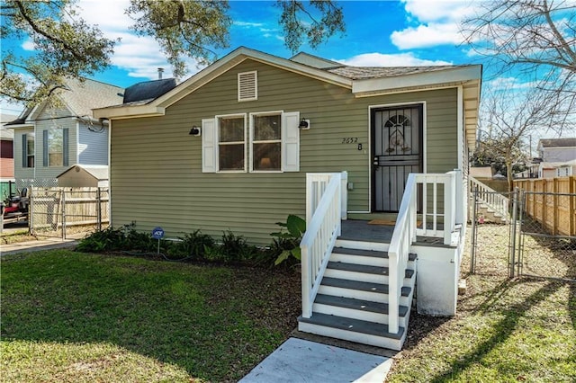 bungalow with a front lawn