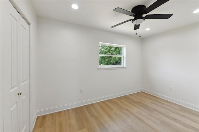 empty room featuring ceiling fan and light hardwood / wood-style floors