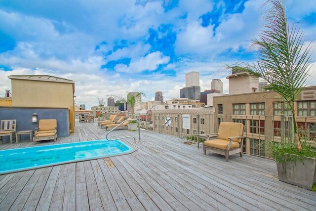 wooden deck with a swimming pool