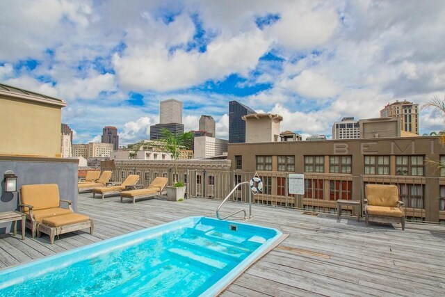 view of swimming pool with a deck