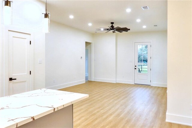 entrance foyer featuring ceiling fan and light hardwood / wood-style flooring