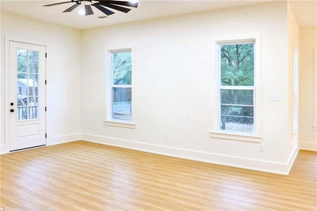 entryway with ceiling fan and light hardwood / wood-style floors