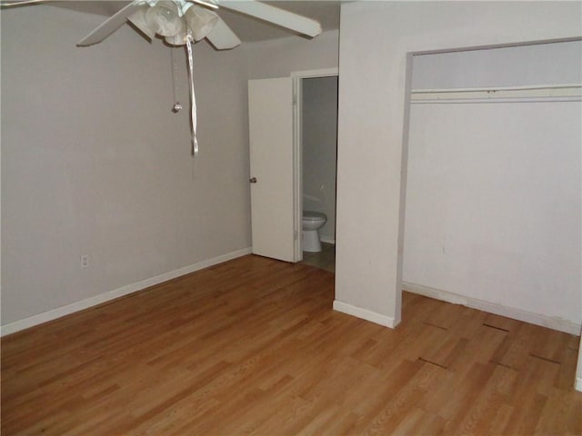 unfurnished bedroom featuring ceiling fan, light wood-type flooring, and a closet