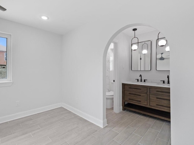 bathroom featuring vanity and toilet