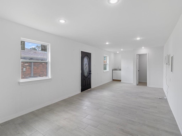 entrance foyer with light wood-type flooring