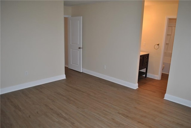 empty room featuring dark wood-type flooring