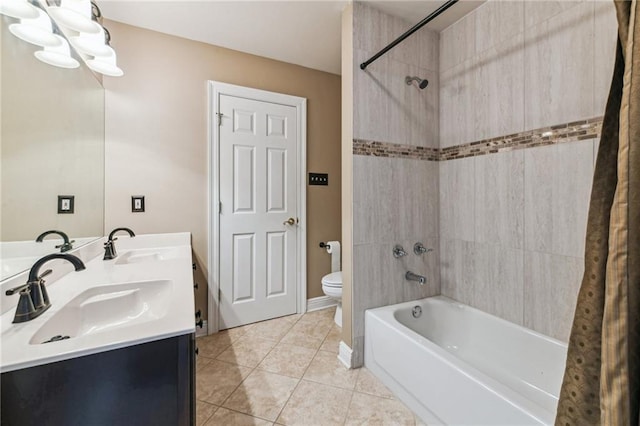 full bathroom featuring shower / bath combination, toilet, vanity, and tile patterned flooring