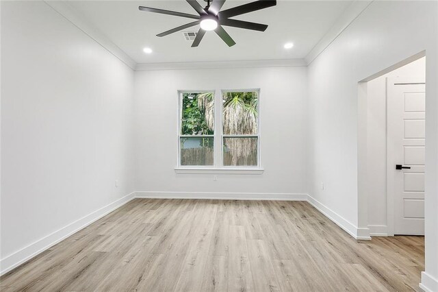 unfurnished room featuring crown molding, ceiling fan, and light wood-type flooring