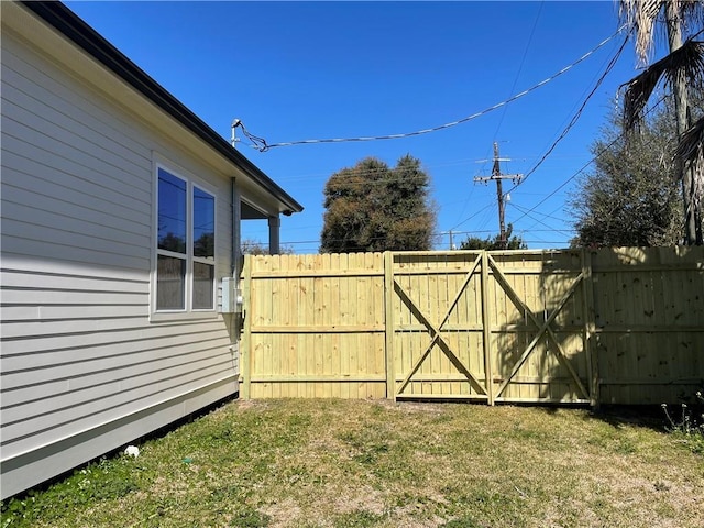 view of yard with a gate and fence