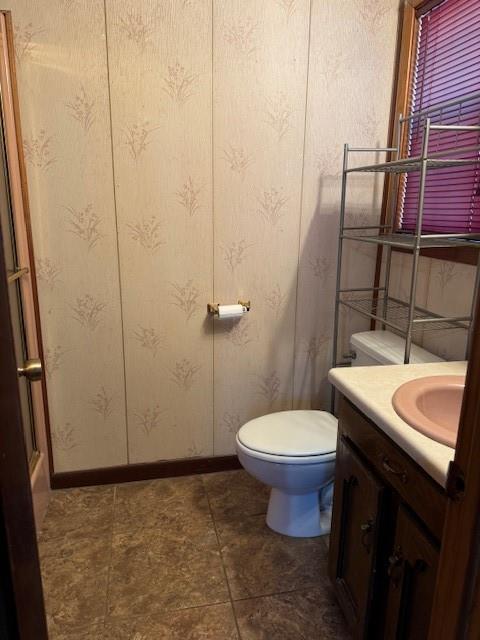 bathroom with toilet and vanity