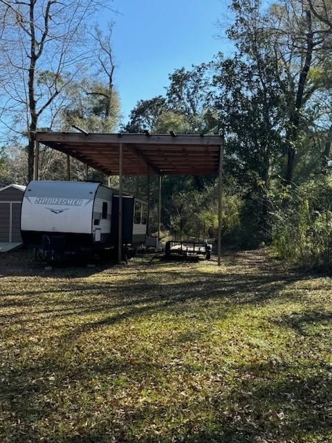 view of yard featuring a carport