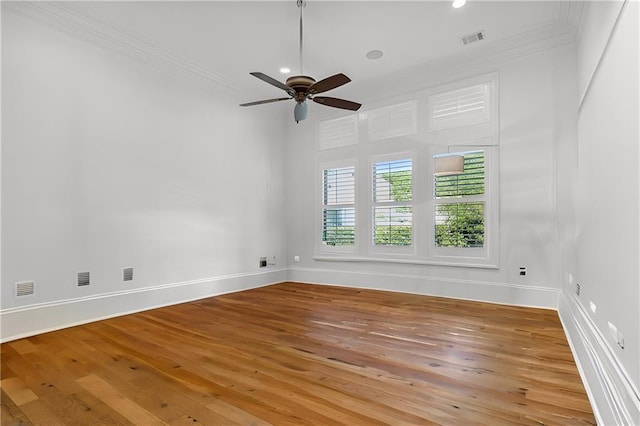 spare room featuring ceiling fan, crown molding, and hardwood / wood-style flooring