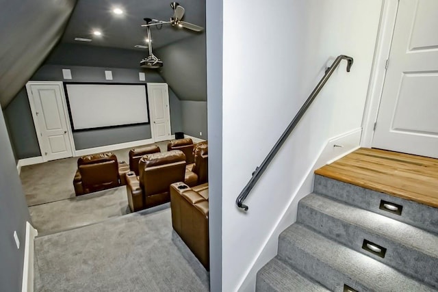 home theater room with ceiling fan and lofted ceiling