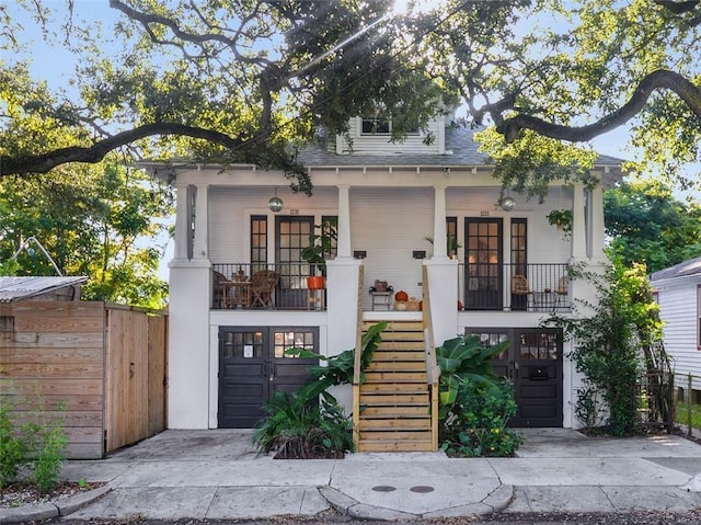 view of front of home featuring covered porch and a garage