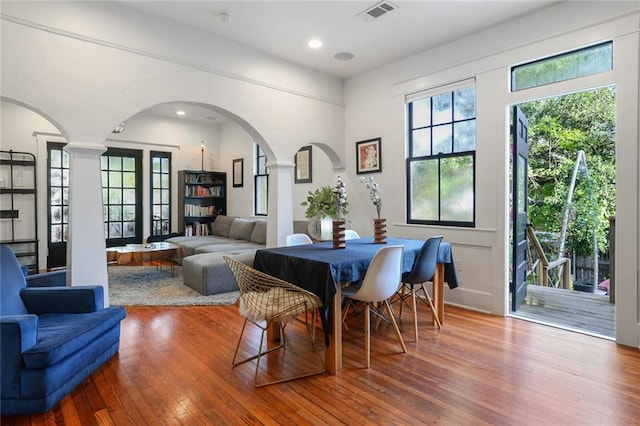 dining space with hardwood / wood-style flooring and plenty of natural light