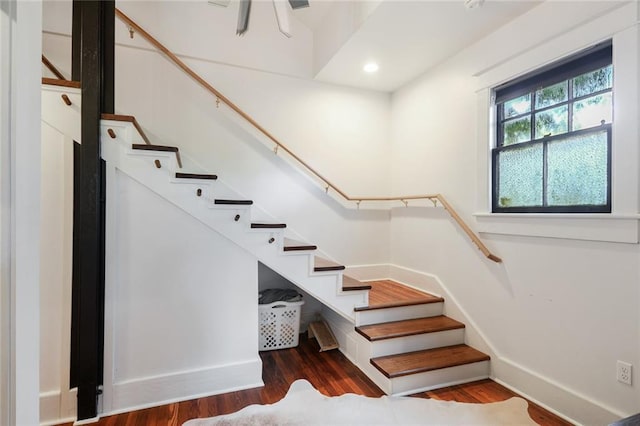 stairway featuring hardwood / wood-style flooring