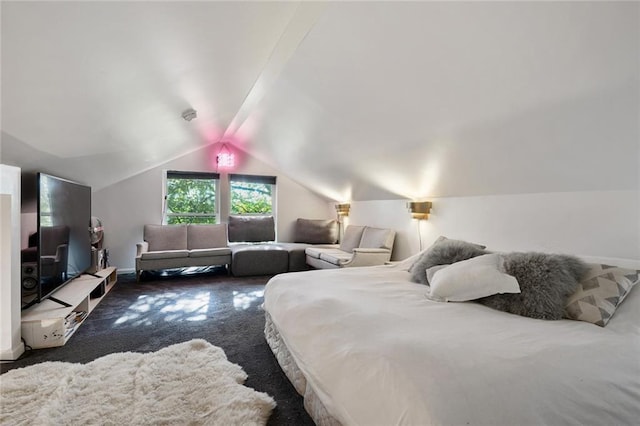 bedroom featuring dark carpet and lofted ceiling