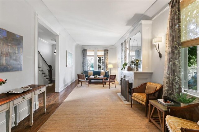 interior space with crown molding and hardwood / wood-style floors