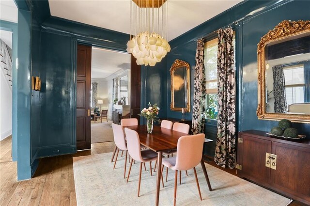 dining space featuring a chandelier and hardwood / wood-style flooring