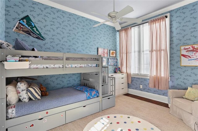 bedroom with ceiling fan, crown molding, and light hardwood / wood-style floors