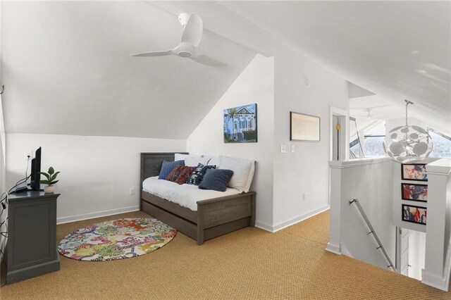 bedroom with ceiling fan, light colored carpet, and lofted ceiling