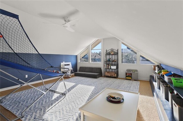 game room featuring ceiling fan, carpet floors, and lofted ceiling