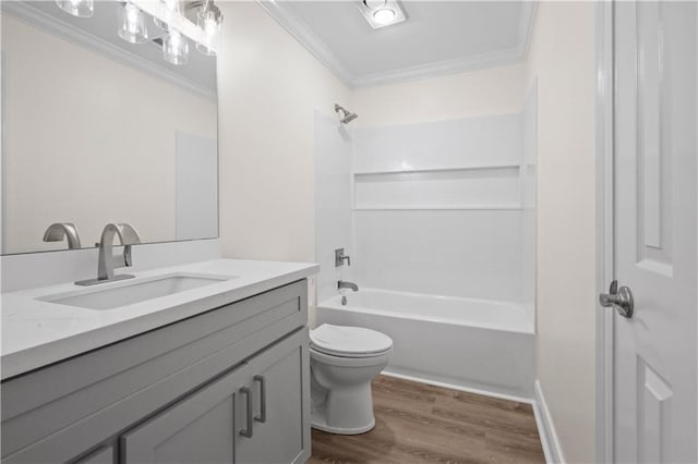 full bathroom with wood-type flooring, bathtub / shower combination, vanity, ornamental molding, and toilet