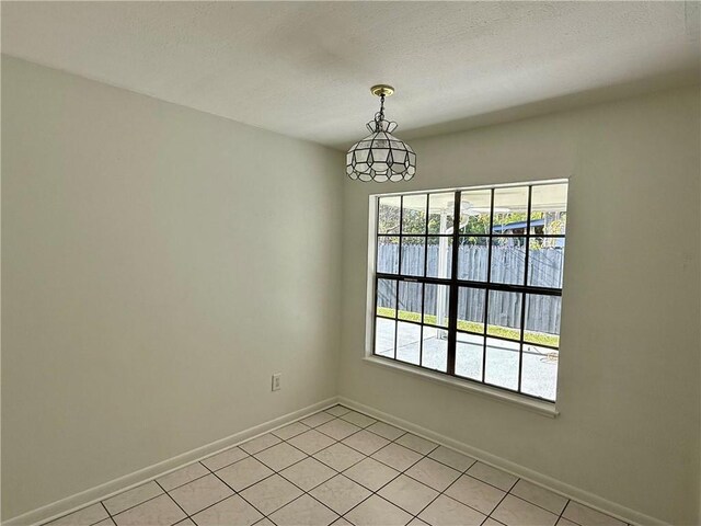 view of tiled spare room