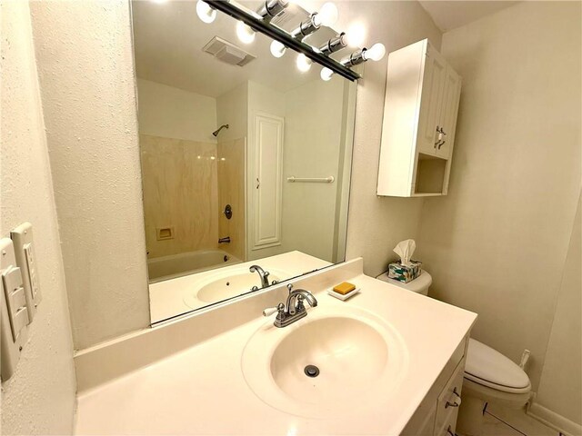 full bathroom with toilet, tile patterned flooring, tub / shower combination, and vanity