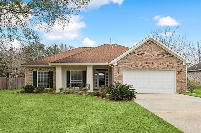 ranch-style home with a garage and a front lawn