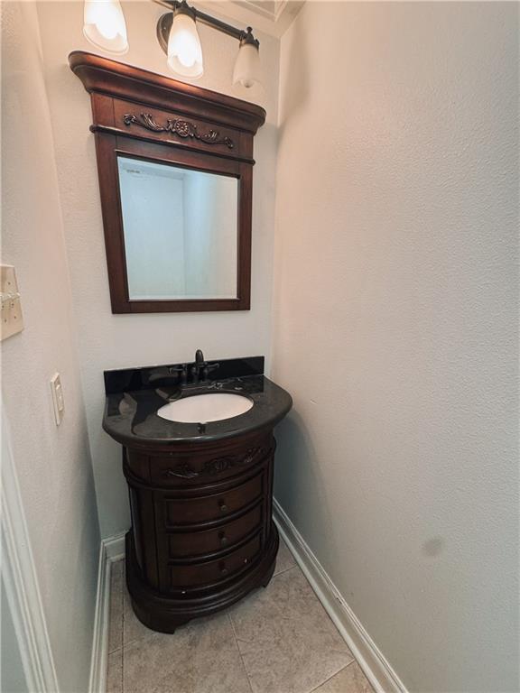 bathroom with vanity and tile patterned floors