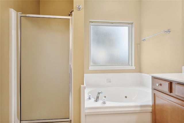 bathroom with separate shower and tub and vanity