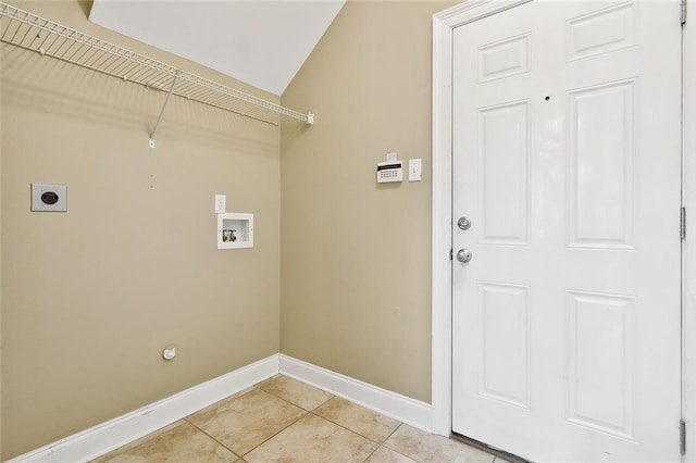 laundry area with hookup for an electric dryer, hookup for a washing machine, and light tile patterned flooring