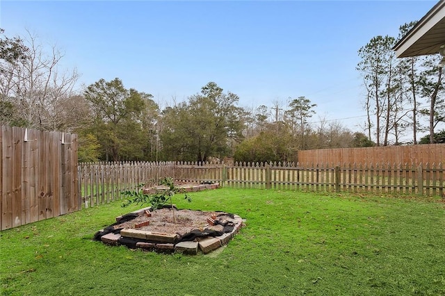 view of yard with an outdoor fire pit