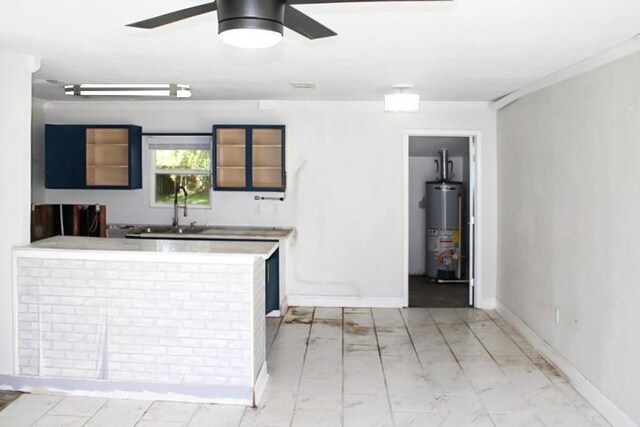 kitchen with water heater, ceiling fan, and sink